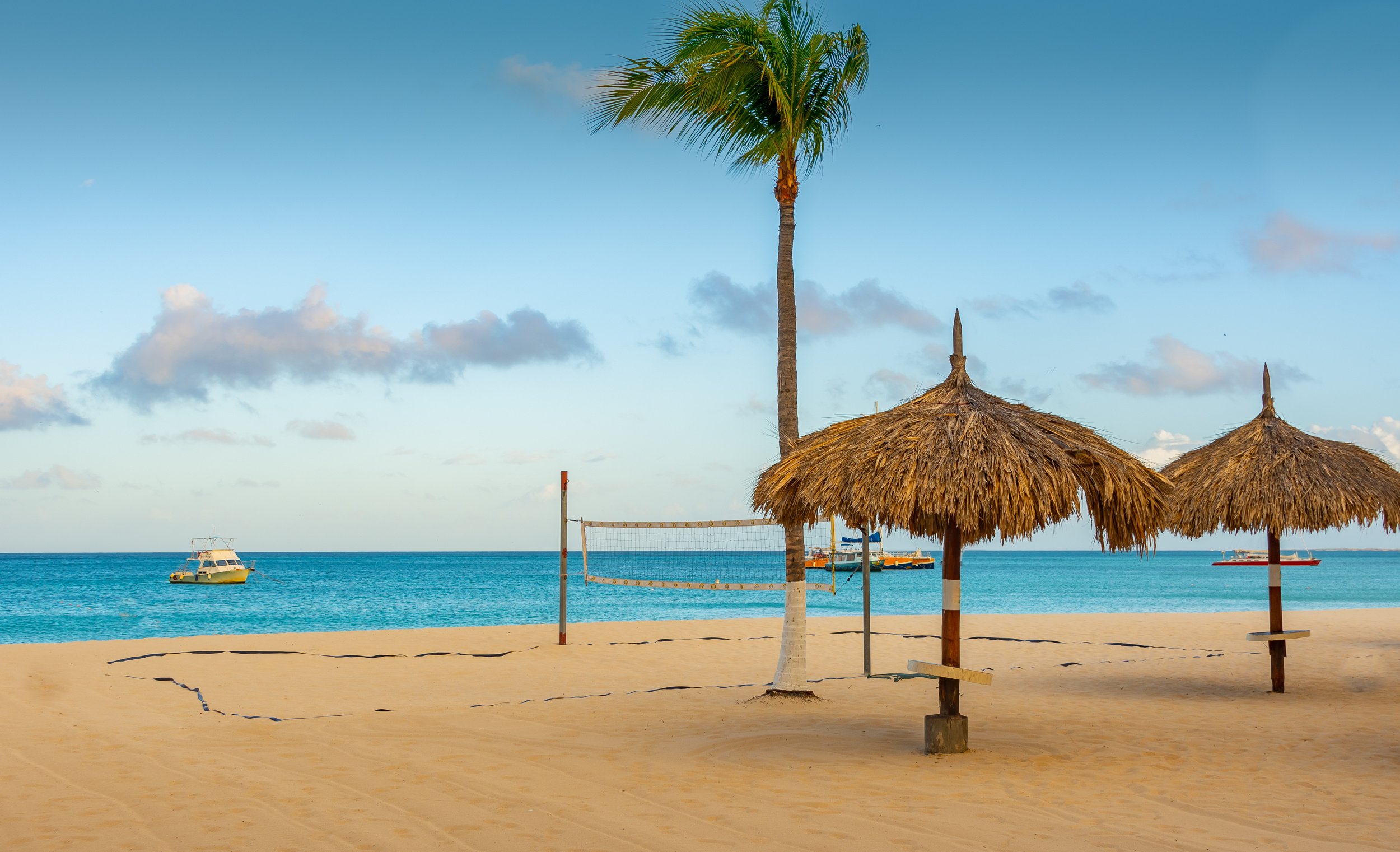 Beach side view under a tiki hut